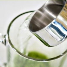 Whisk the Matcha and water together until the Matcha appears to be dissolved in the water.